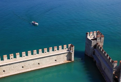 Harbour basin of the castle with flat Guelph battlements, Scaliger Castle, Castello Scaligero, in