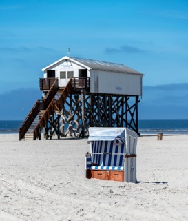 Beach chairs and signs on the sandy beach of the North Sea, Sankt Peter-Ording, Schleswig-Holstein,