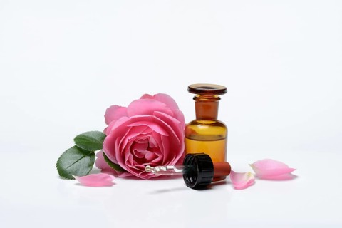 Rose oil, rose blossom and rose oil in vials
