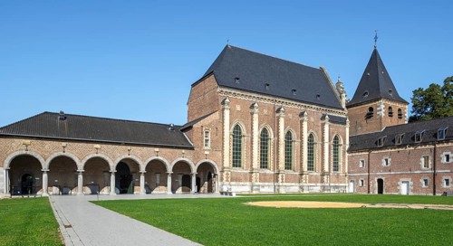 Outer court, arcade and Baroque church of Commandery of Alden Biesen, 16th-century castle at