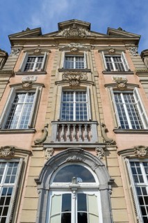 Façade with high relief architectural ornaments above windows of 1750 Poeke Castle, Kasteel van
