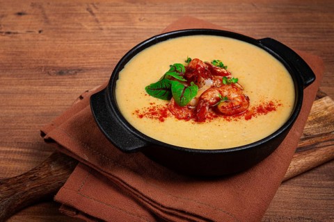 Pumpkin cream soup with shrimp, herbs and spices, homemade, no people