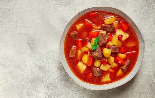 Meat goulash, with potatoes and carrots, sweet pepper, traditional Hungarian soup, homemade, no