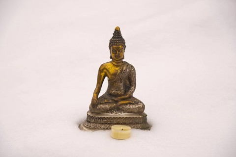 Bhumispara-mudra: Buddha Gautama in the moment of enlightenment, statue in the snow, Oytal,