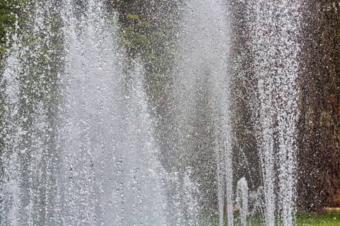 Water fountains, water features, spray mist, park in city centre, symbol photo, urban microclimate,