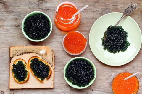 Different kinds of caviar with bread and beverages, AI generated