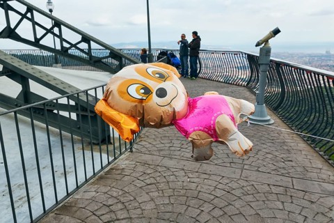 Gas-filled balloon in the shape of a dog, viewing platform, cloudy sky, Tibidabo amusement park,