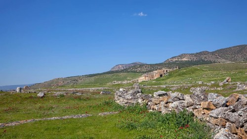 Remains, ruins in Hierapolis, in the background ruins of the ancient theatre Hieropolis, near