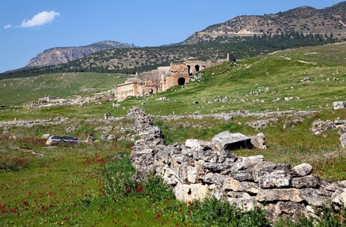 Remains, ruins in Hierapolis, in the background ruins of the ancient theatre Hieropolis, near