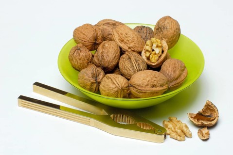 Walnuts (Juglans regia) and nutcrackers, shell
