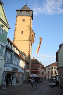 Bavarian tower built 14th century with flag and town coat of arms in Lohr am Main, Lower Franconia,