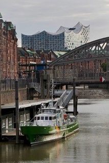 Customs canal with the ship of the Customs Museum of the Kornhaus Bridge and the Elbphilarmonie,