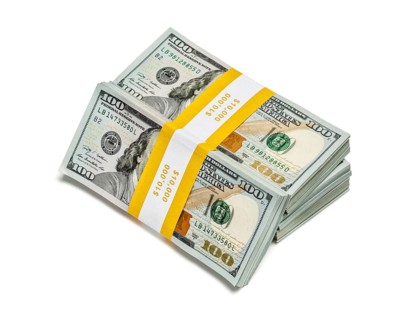 Creative business finance making money concept, stack of bundles of 100 US dollars 2013 edition