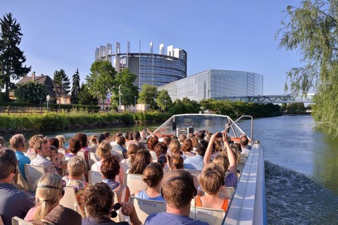 Excursion boat with tourists in front of the buildings of the European Parliament, Strasbourg,