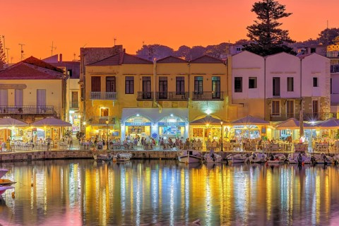 Venetian harbour, dusk, night shots, orange sky, colourful rows of houses, water reflection,