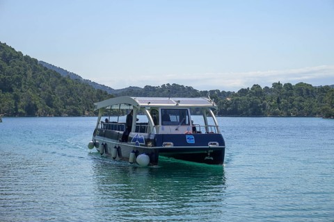 Electric ferry with solar roof sails to Benedictine Abbey, Mljet Island, Dubrovnik-Neretva County,