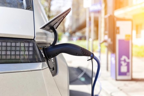 Charging the battery of an electric car with electricity E-car at an electric petrol station petrol