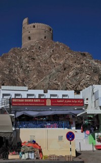 Shops and old watchtower, Mutrah, Muscat, Oman, Asia
