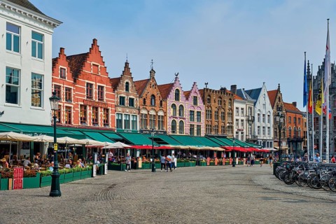 Bruges, Belgium, May 29, 2018: Bruges Grote markt square famous tourist place with many cafe and