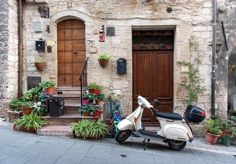Vespa scooter in the streets of Assisi Old Town, Umbria, Italy, Europe