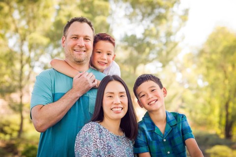 Outdoor portrait of biracial chinese and caucasian family