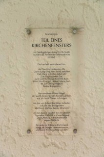 Information board, part of a church window, historical and partly destroyed church window,
