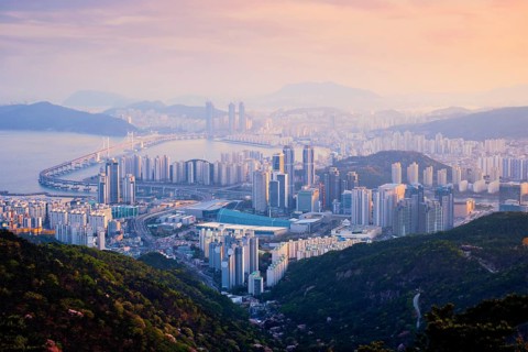 Busan cityscape with skyscrapers and Gwangan Bridge on sunset from Jangsan peak. Busan, South