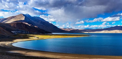 Panorama of Himalayan lake Tso Moriri and Korzok village in Himalayas on sunset, Ladakh, India,