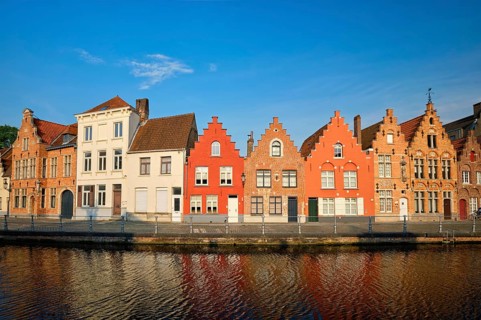 Typical Belgian cityscape Europe tourism concept, canal and old houses on sunset. Bruges (Brugge),