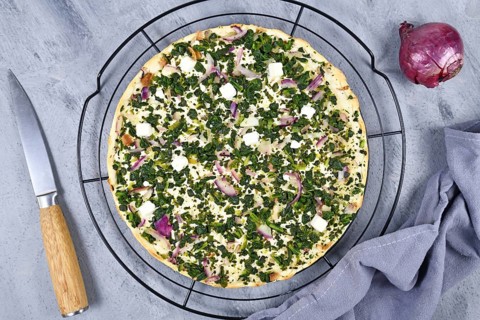 Flammkuche or Tarte Flambee, a thin pizza-like baked pie from German-French Alsace border region,
