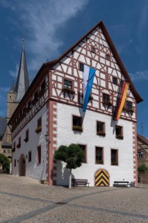 Historic town hall, half-timbered 1540, St. Michael's Church in the back, Zeil am Main, Lower