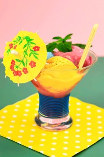 Sundae with homemade ice cream, yellow umbrella, ice cream cone and mint leaves, summer, Germany,