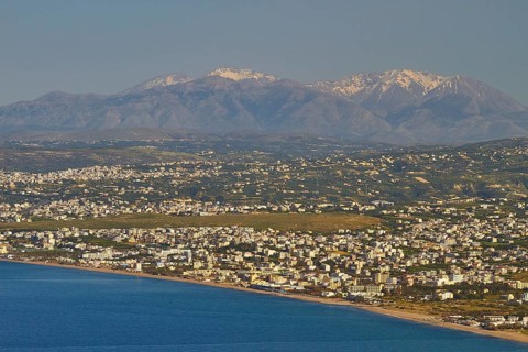 Panorama shot, overview, Dikte massif, snow-capped mountains, sea of houses, blue sea, coast,