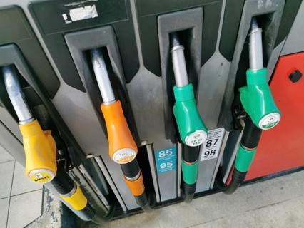 Petrol pump with nozzles for petrol and diesel at a motorway filling station in France