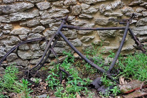 Remains of a burnt bicycle. The burnt village of Oradour-sur-Glane was destroyed on 10 June 1944