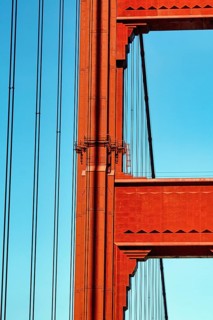 Orange pylon and steel cables of the suspension bridge, detail, Golden Gate Bridge, blue sky, San