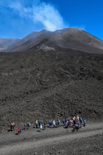 Hikers in the crater landscape of the volcano Etna, summit region, province of Catania, Sicily,