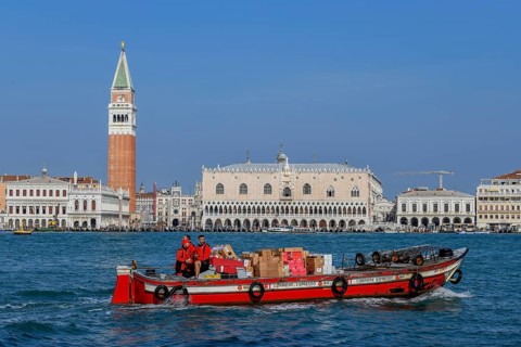 Delivery boat of the parcel service DPD on the Grand Canal in front of the Markusturm and the