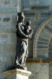 Ebreuil village, statue of the virgin and child at the foot of the Saint-Leger benedictine abbey,