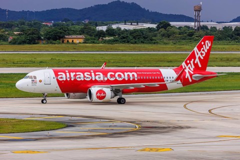 An AirAsia Airbus A320neo aircraft with the registration 9M-AGH at Hanoi Airport, Vietnam, Asia