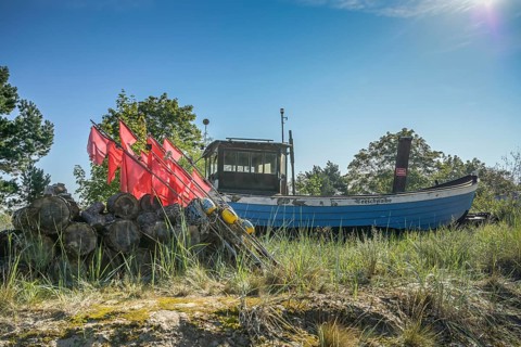 Fishing boat, installation of a fisherman behind the dune, Heringsdorf, Usedom,