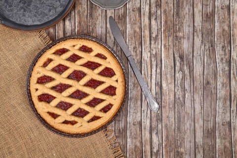 Top view of homemade pie called 'Linzer Torte', a traditional Austrian shortcake pastry topped with