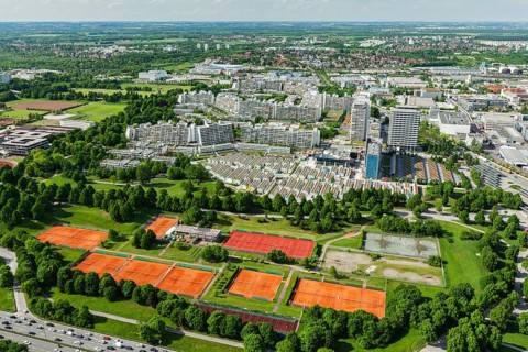 Aerial view of Munich Olympic village and tennis couts from Olympiaturm (Olympic Tower) . Munich,