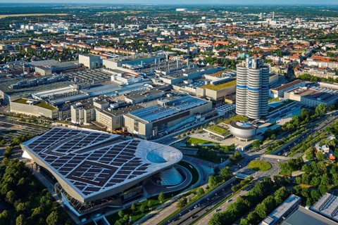 MUNICH, GERMANY, JULY 08, 2018: Aerial view of BMW Museum and BWM Welt and factory and Munich from