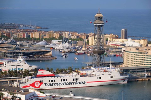 BARCELONA, SPAIN, APRIL 15, 2019: Aerial view of Barcelona city skyline with city traffic and port