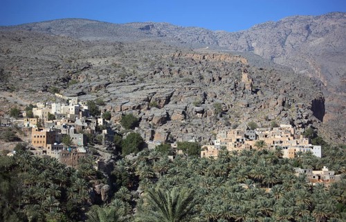 Al-Hamra is one of the many interesting oases with an old mud part with red houses on stone