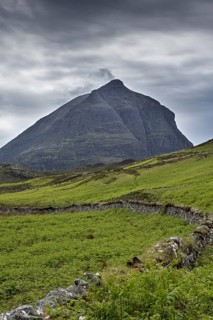 Old dry stone wall in front of mountain top Sàil Gharb, one Quinag's three separate Corbett summits