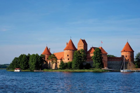 Trakai Island Castle in lake Galve with boats in summer day, Lithuania. Trakai Castle is one of