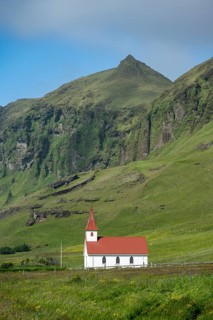 Vik Church, Víkurkirkja, between green mountains, Vík, South Iceland, Iceland, Europe