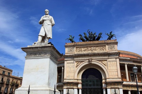 In the old town of Palermo, the Teatro Politeama Garibaldi and the statue of Giuseppe Garibaldi,